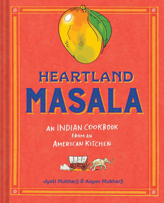 Red and orange cookbook with mango and text in blue "Heartland Masala" by Jyoti Mukharji & Auyon Mukharji